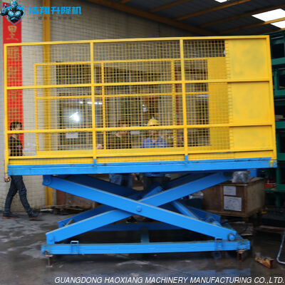 Harga yang bagus 4 Ton Meja Angkat Stasioner Mesin Angkat Gunting Stasioner Platform Angkat Gunting Tetap Untuk Pemuatan Barang on line